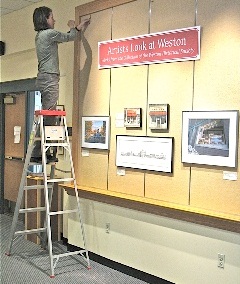 Mary Gregory hanging the show