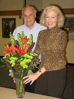 Jack and Tania Deary with floral arrangement